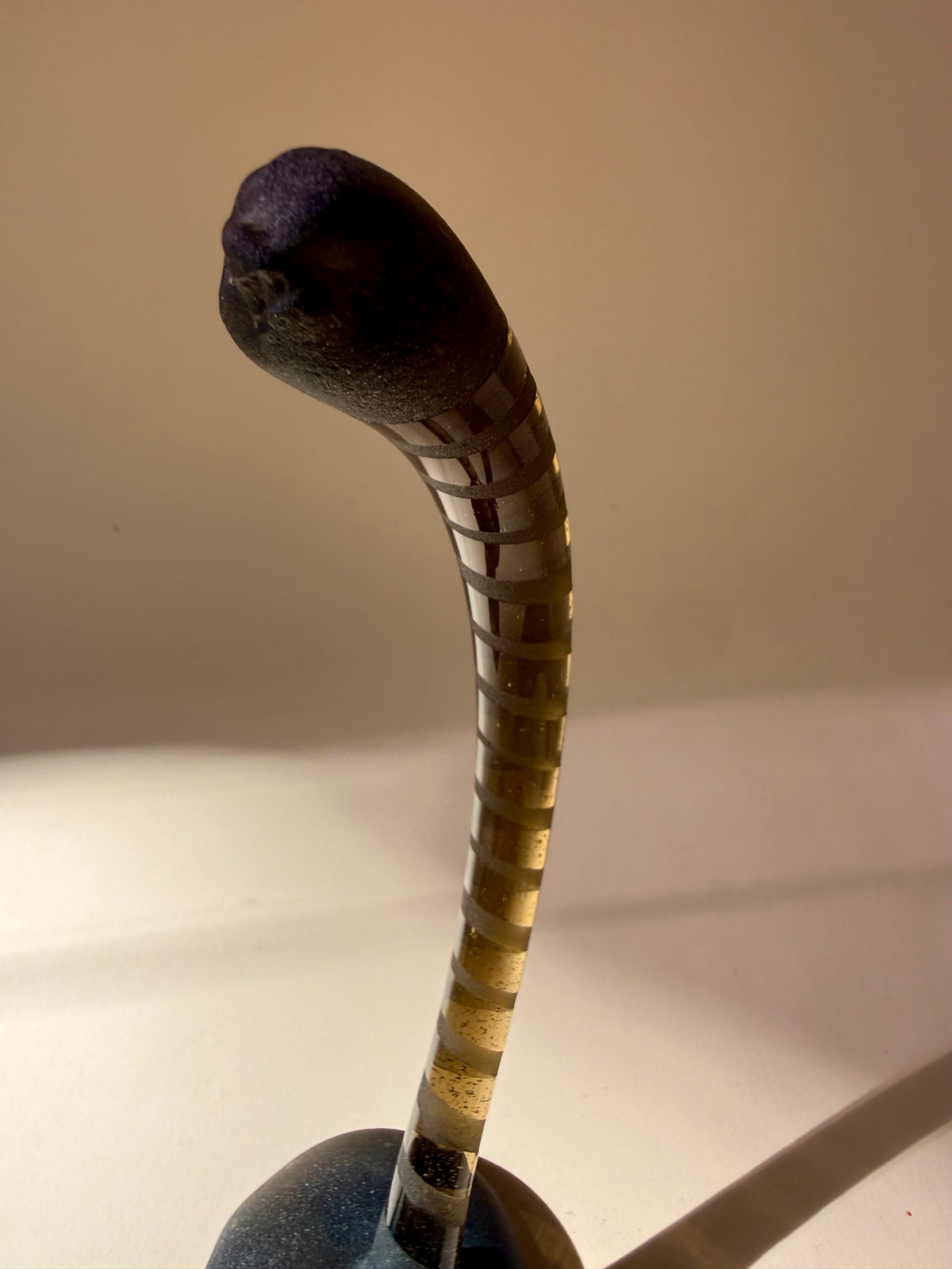 pair of handblown amber glass snake-like abstract sculptures