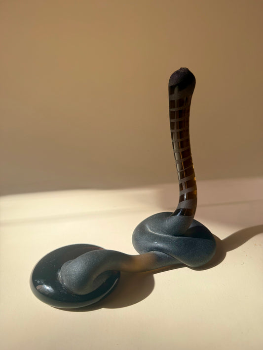 pair of handblown amber glass snake-like abstract sculptures