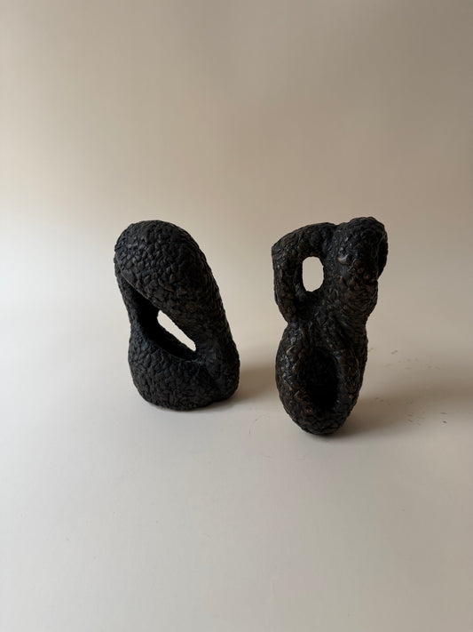 pair of modernist biomorphic bronze sculptures