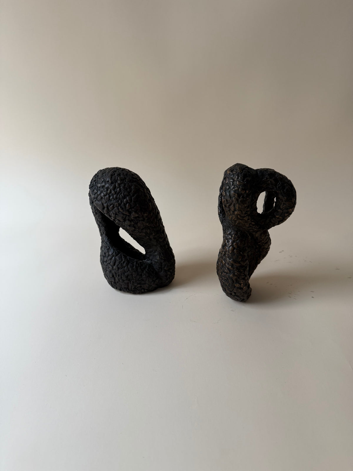 pair of modernist biomorphic bronze sculptures