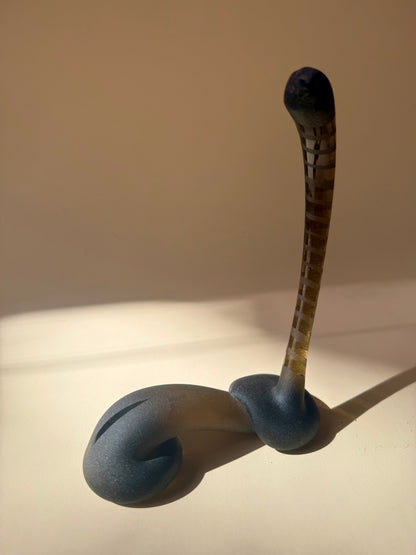pair of handblown amber glass snake-like abstract sculptures
