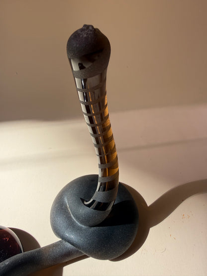 pair of handblown amber glass snake-like abstract sculptures