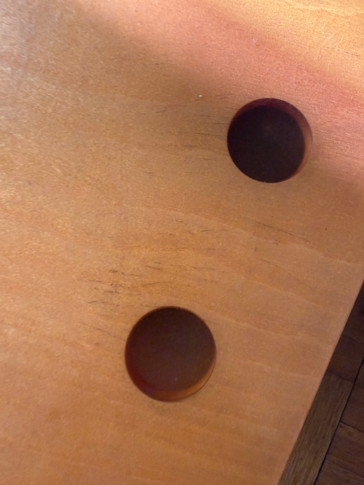 handmade modernist plywood coffee table with aluminum legs and red box underneath