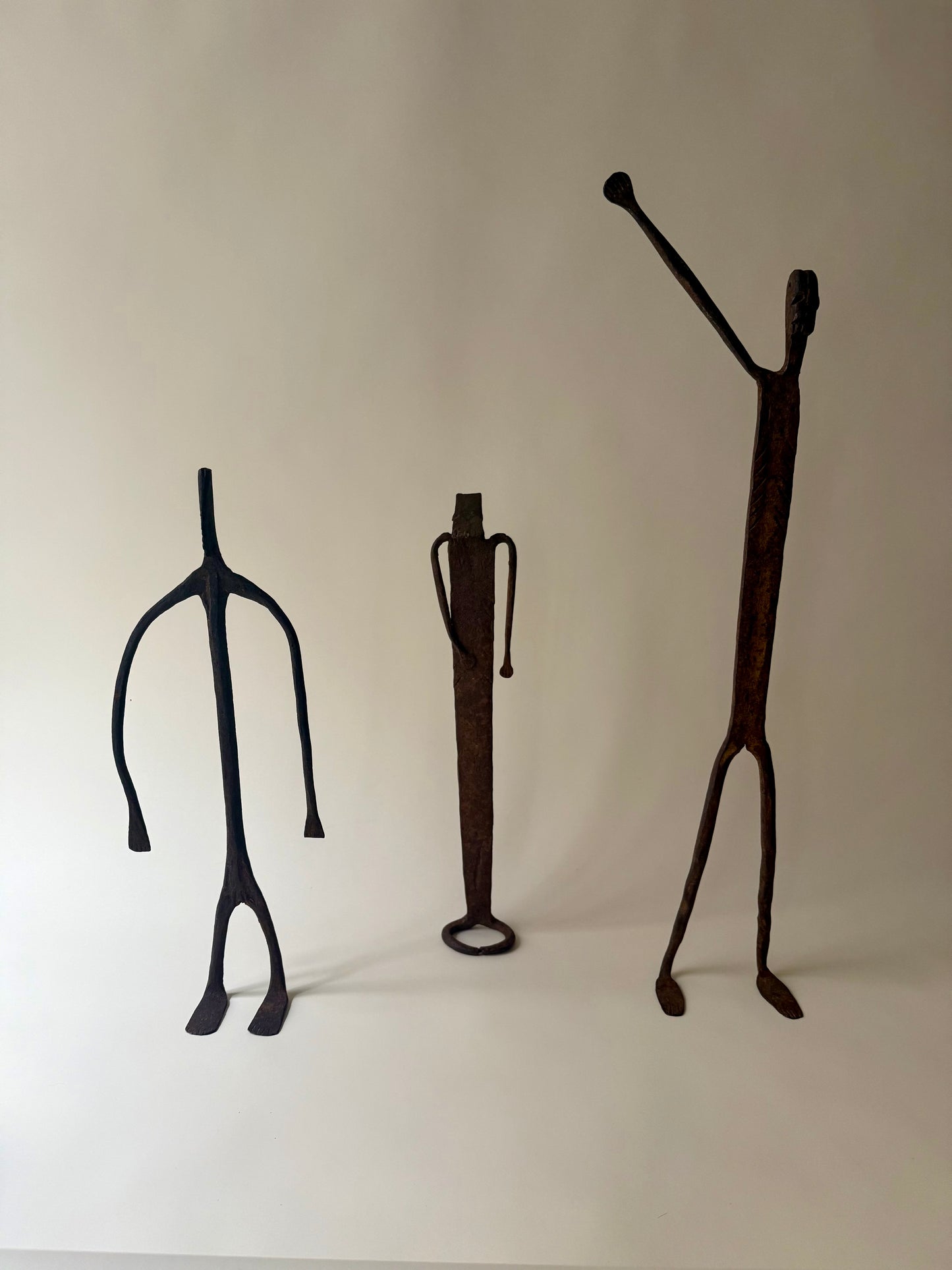 trio of hand-forged iron figural sculptures