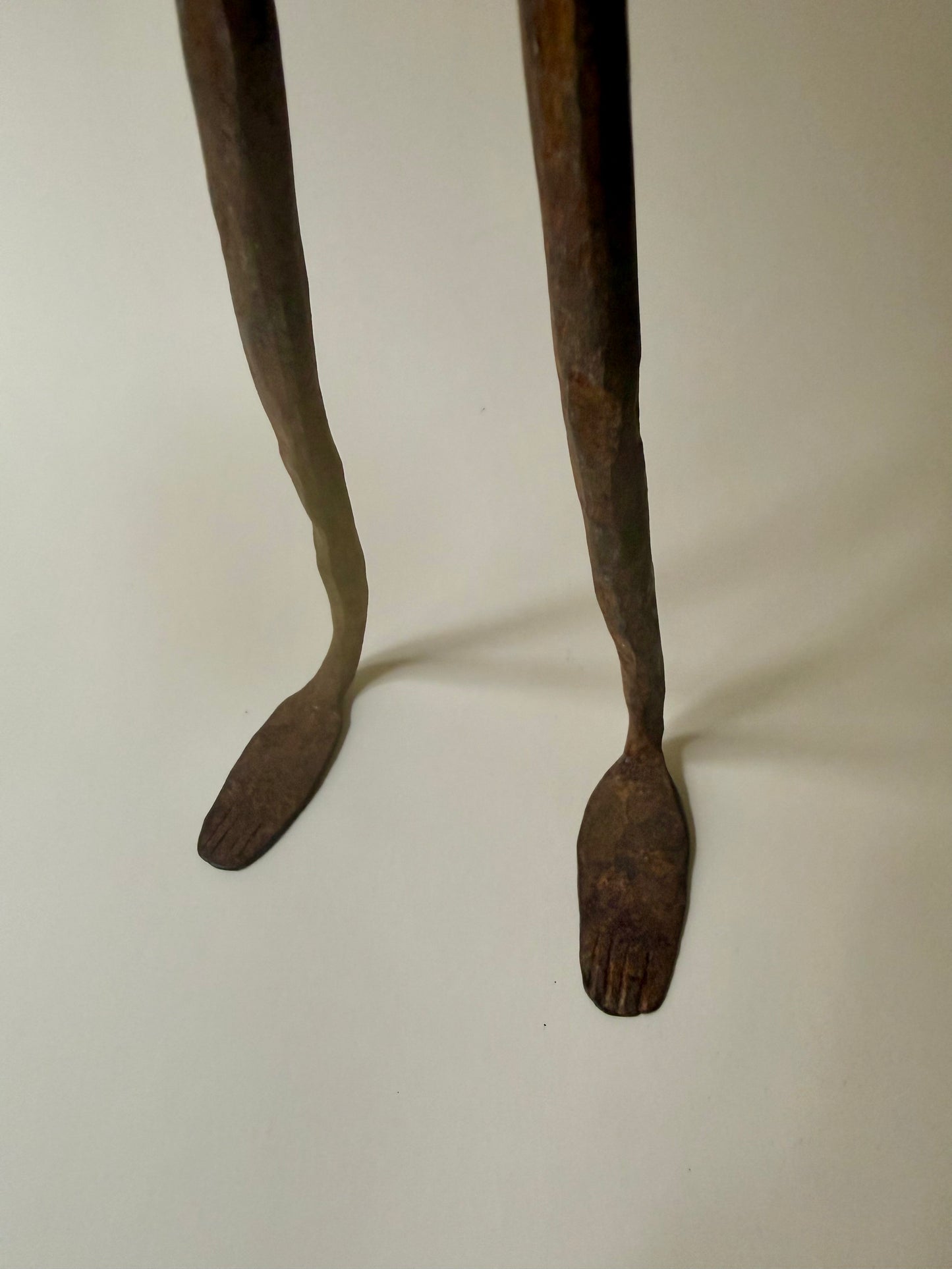 trio of hand-forged iron figural sculptures