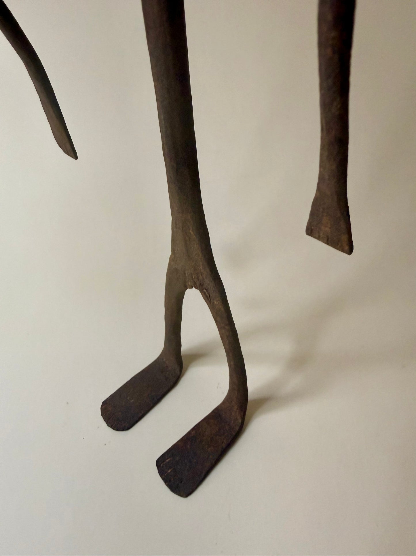 trio of hand-forged iron figural sculptures