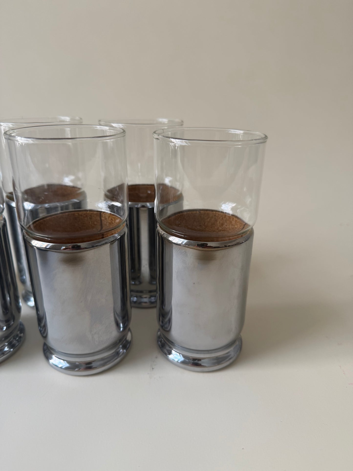set of 6 space age drinking glasses with cork lined chrome covers