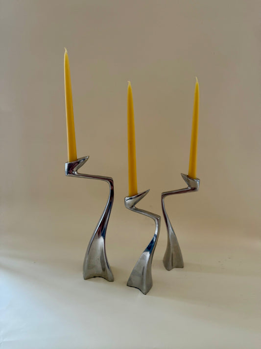1980s set of three aluminum "swan" candlestick holders designed by Matthew Hilton