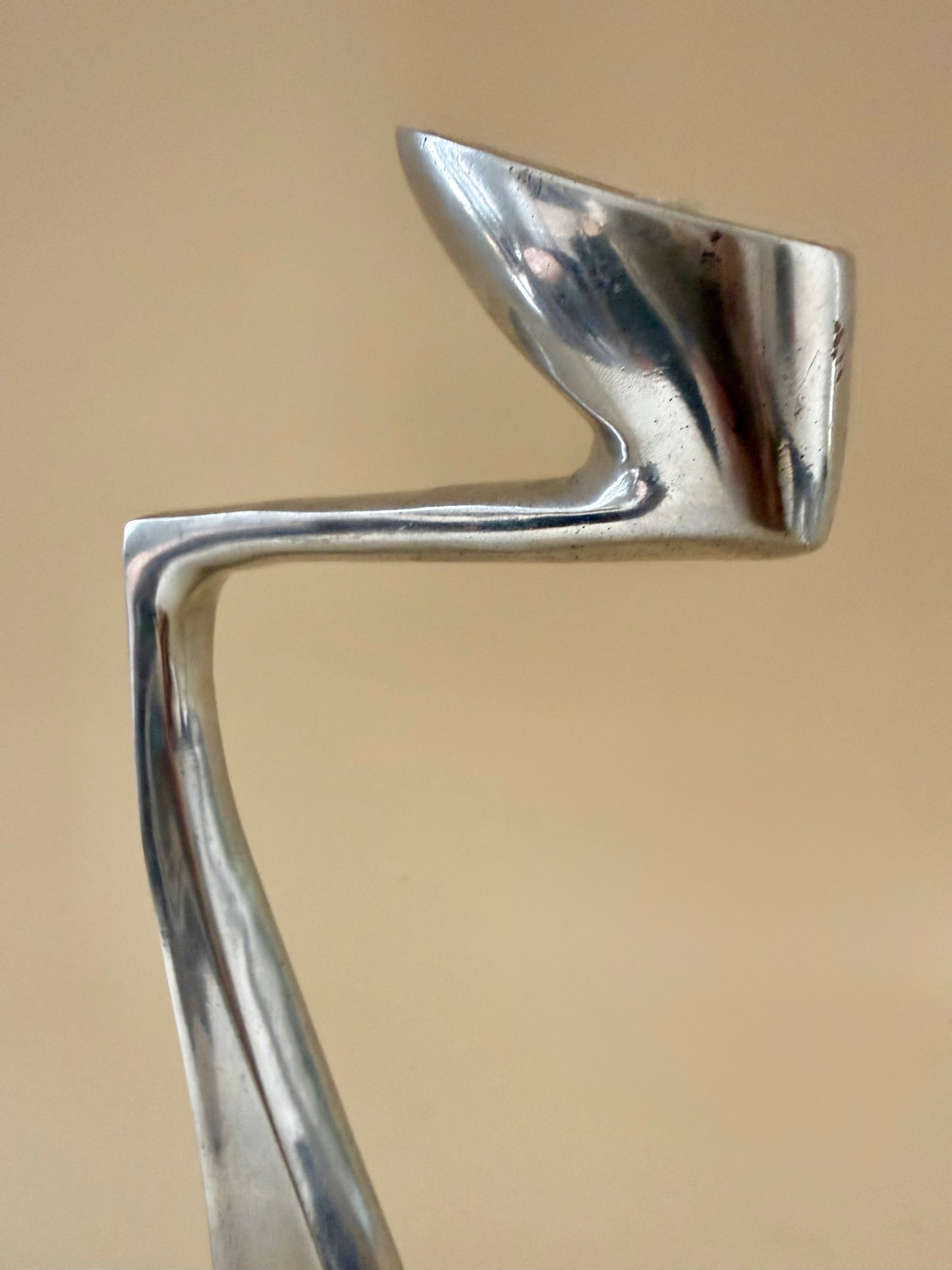 1980s set of three aluminum "swan" candlestick holders designed by Matthew Hilton