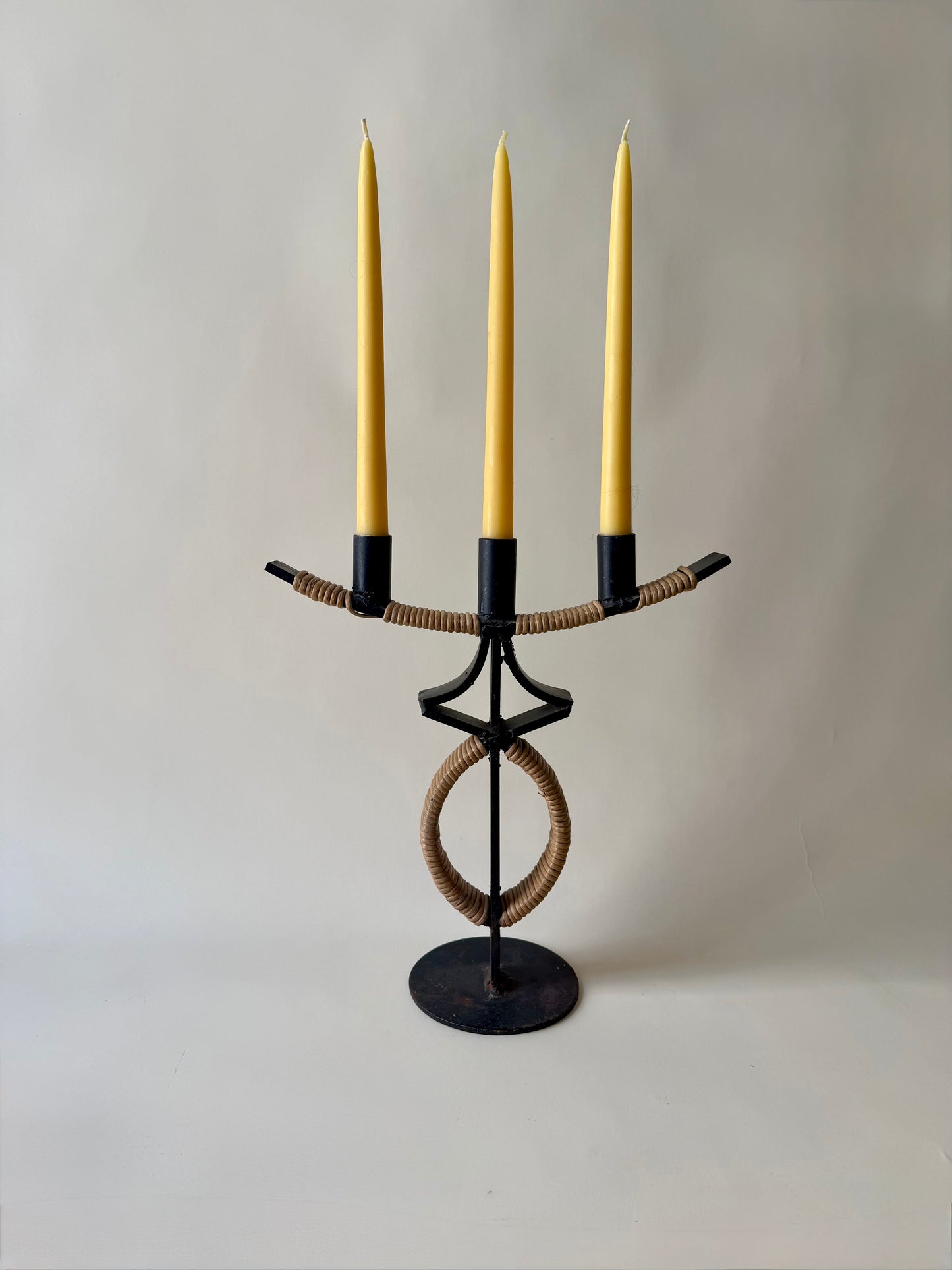 large mid century wrought iron and rattan candleholder attributed to Arthur Umanoff