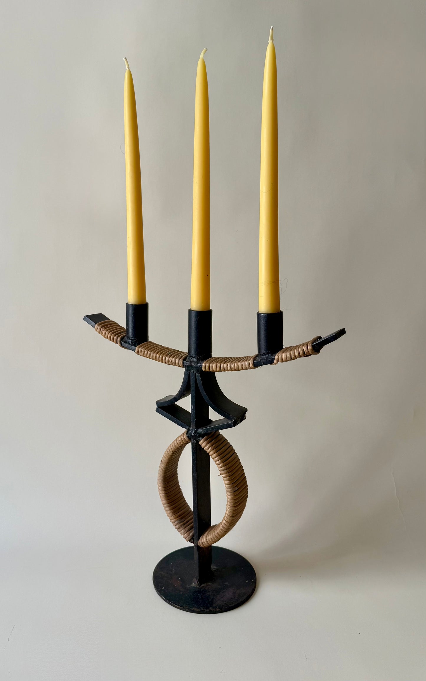 large mid century wrought iron and rattan candleholder attributed to Arthur Umanoff