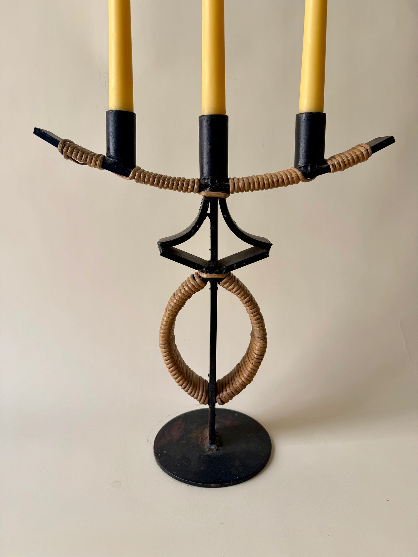 large mid century wrought iron and rattan candleholder attributed to Arthur Umanoff