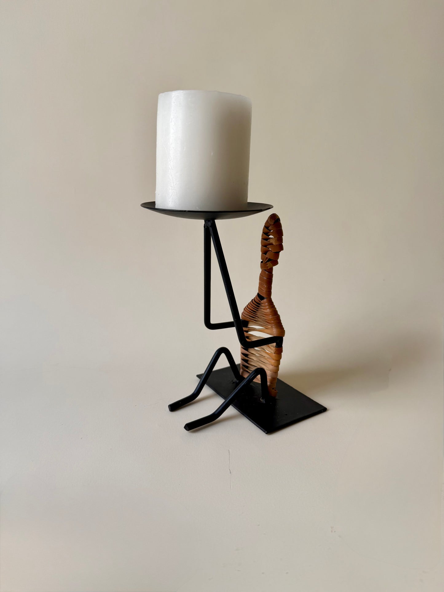 figural iron and rattan candle holder
