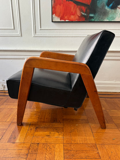 early mid century modern vinly and wood lounge chair attributed to Russel Wright