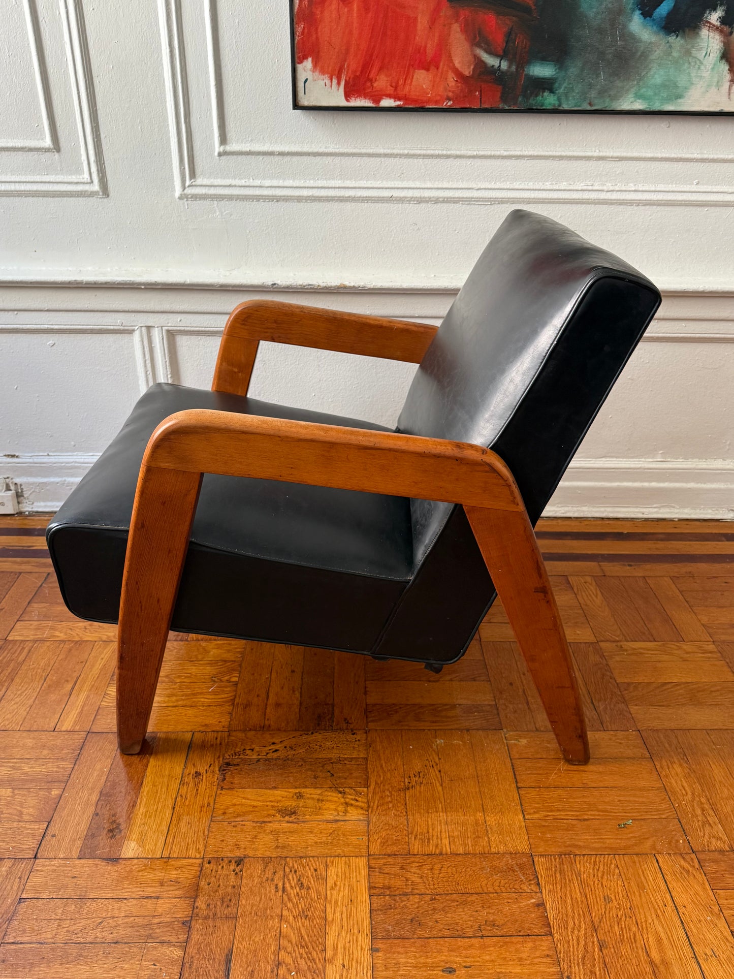 early mid century modern vinly and wood lounge chair attributed to Russel Wright