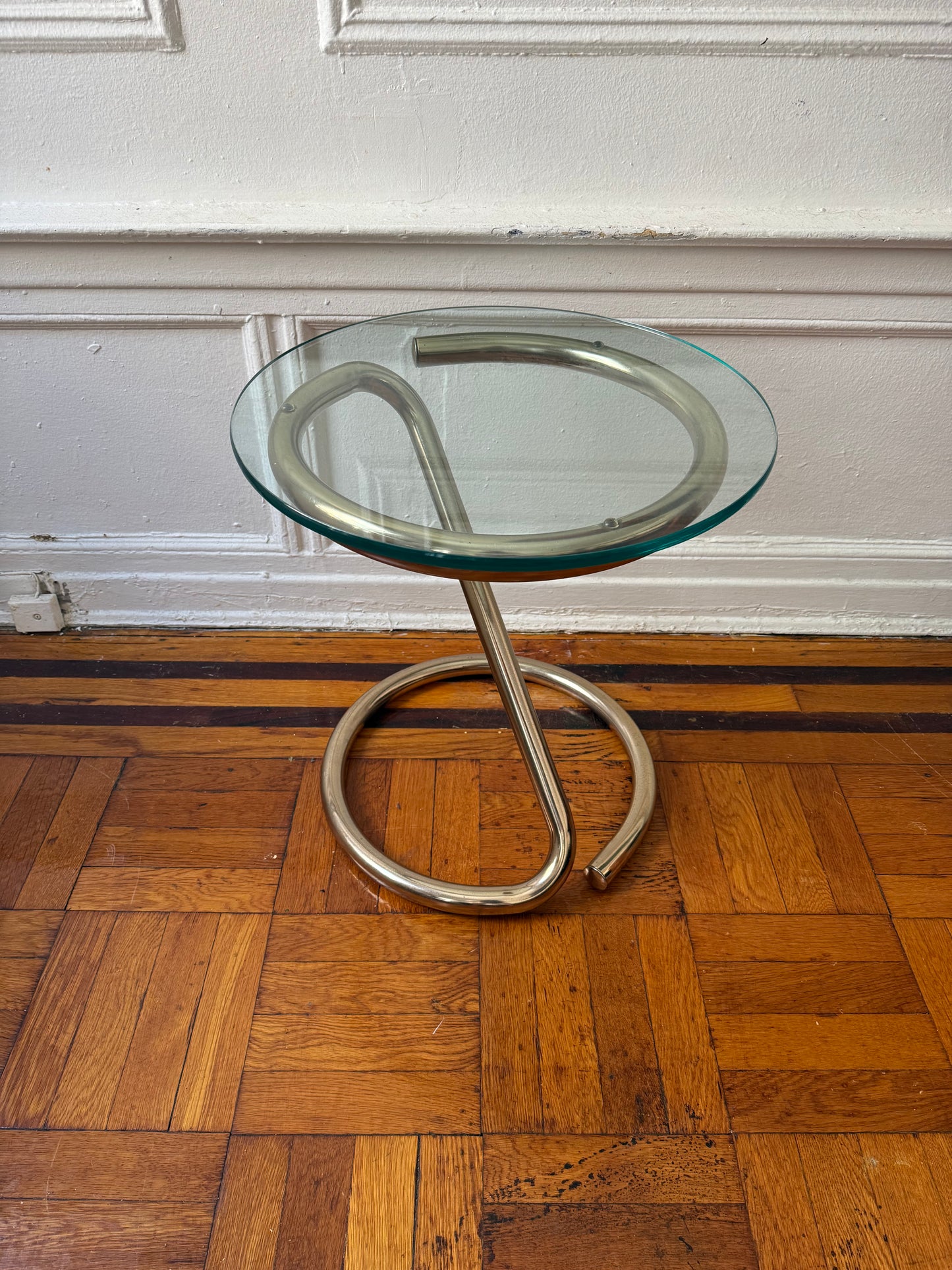 tubular brass sculptural side table with round glass top