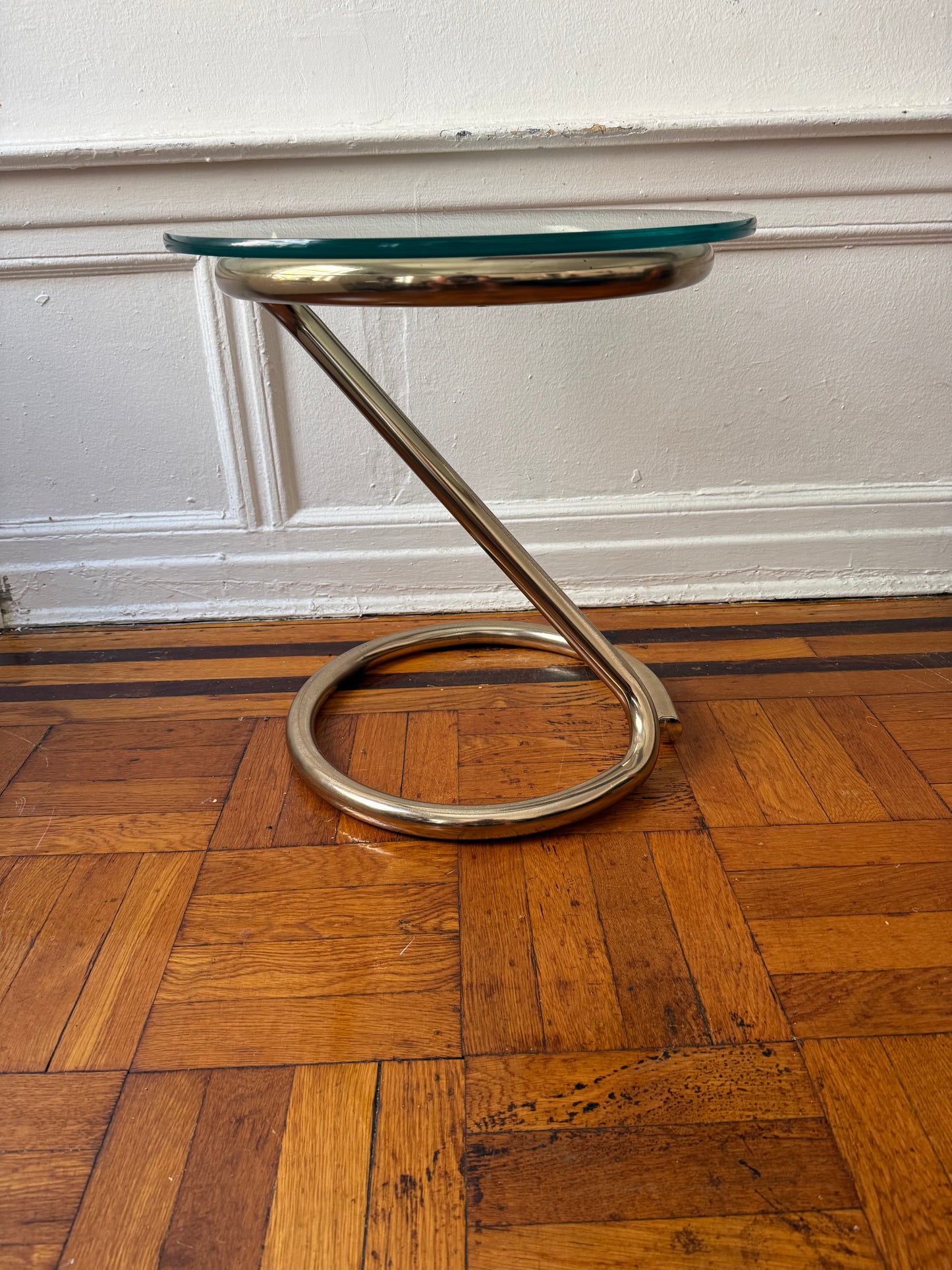 tubular brass sculptural side table with round glass top