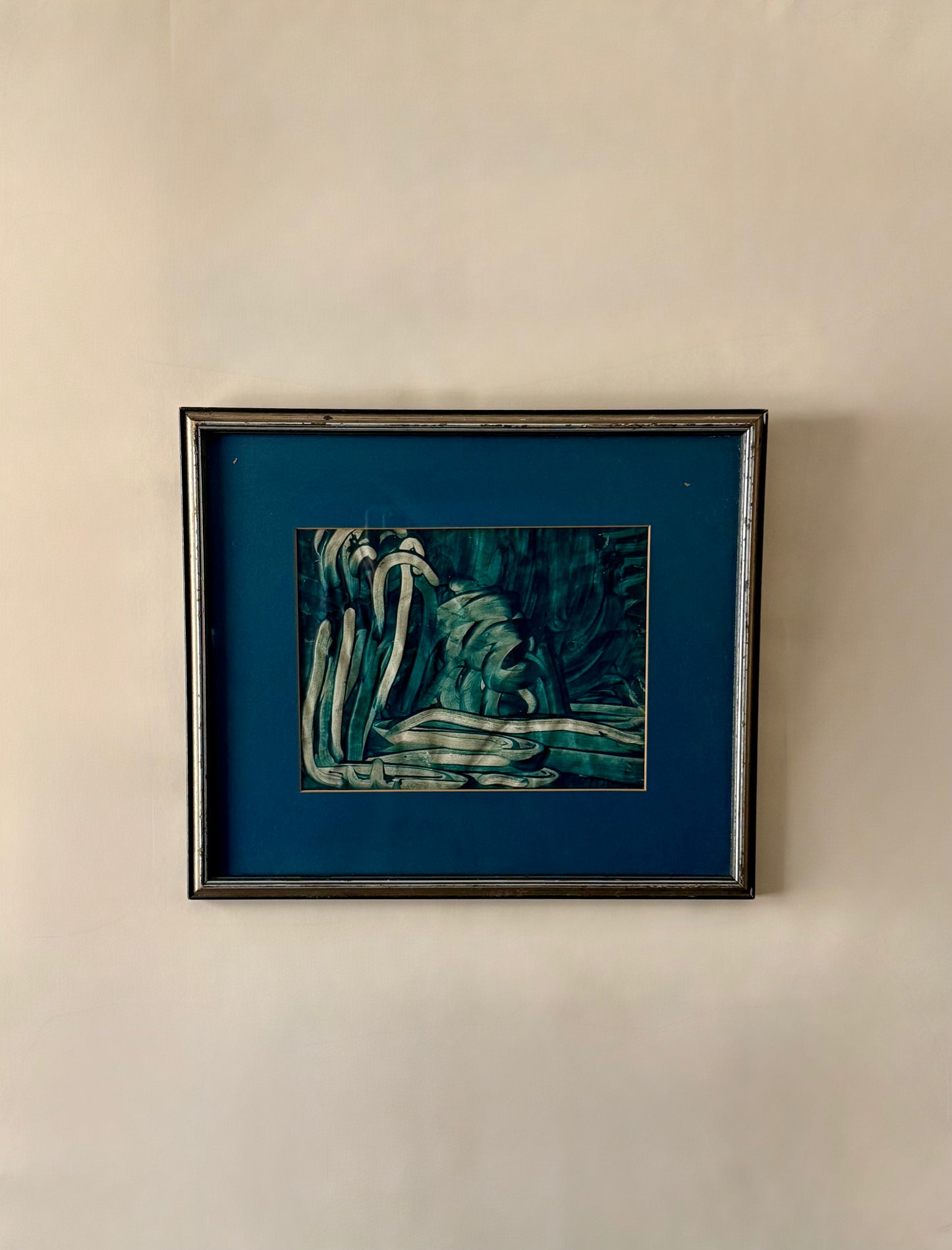 abstract green toned painting with blue mat and silver gilded frame