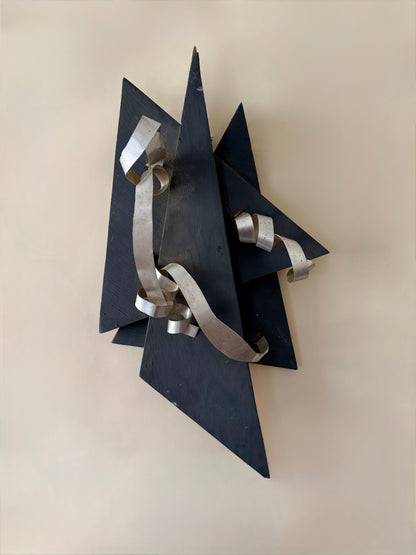 wood and metal abstract wall sculpture in black and and silver