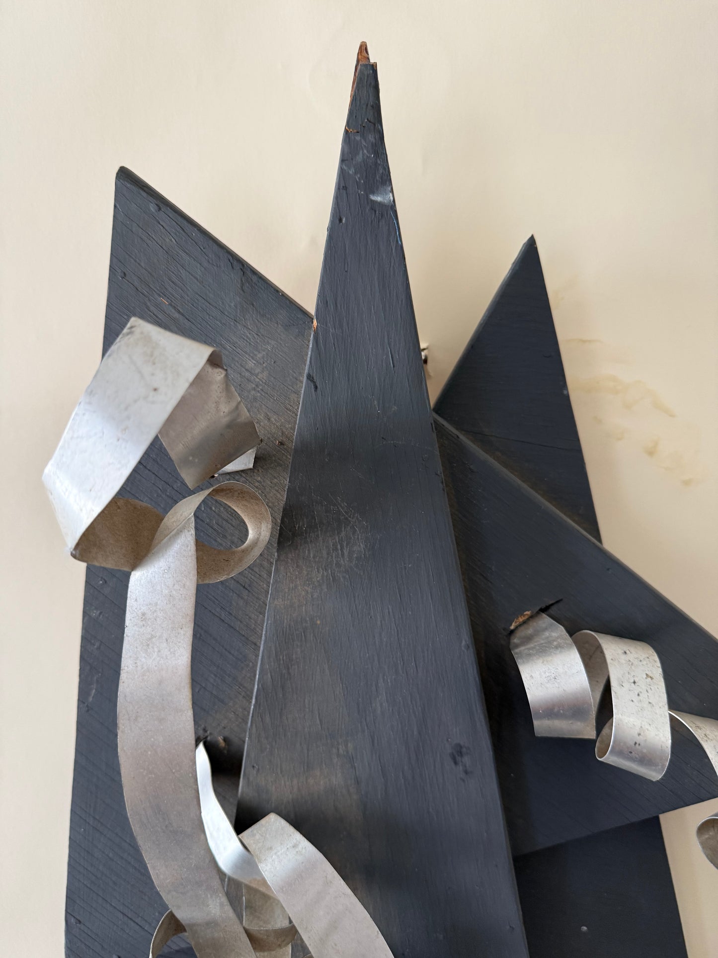 wood and metal abstract wall sculpture in black and and silver